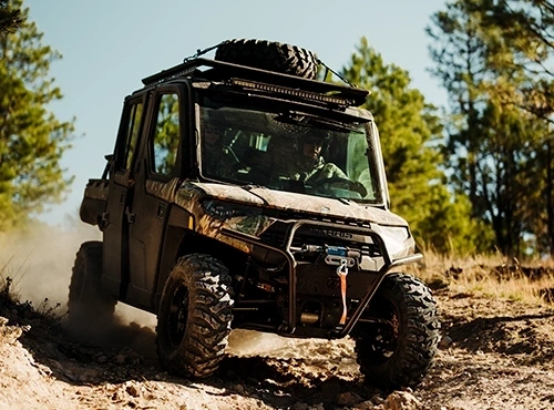 Gloved hand on a vehicle steering wheel
