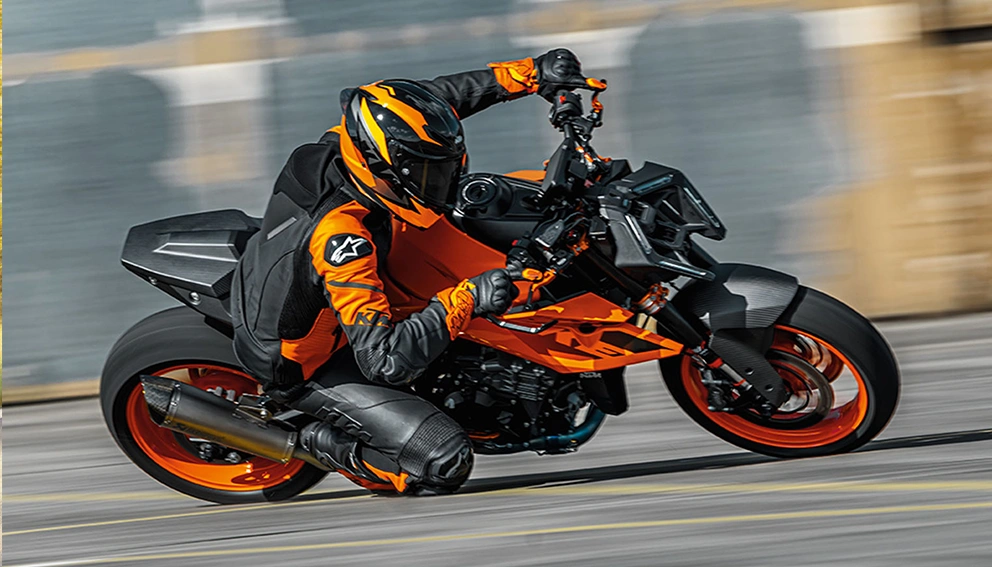 View of a motorcyclist on the road riding a 2027 KTM 790 Duke