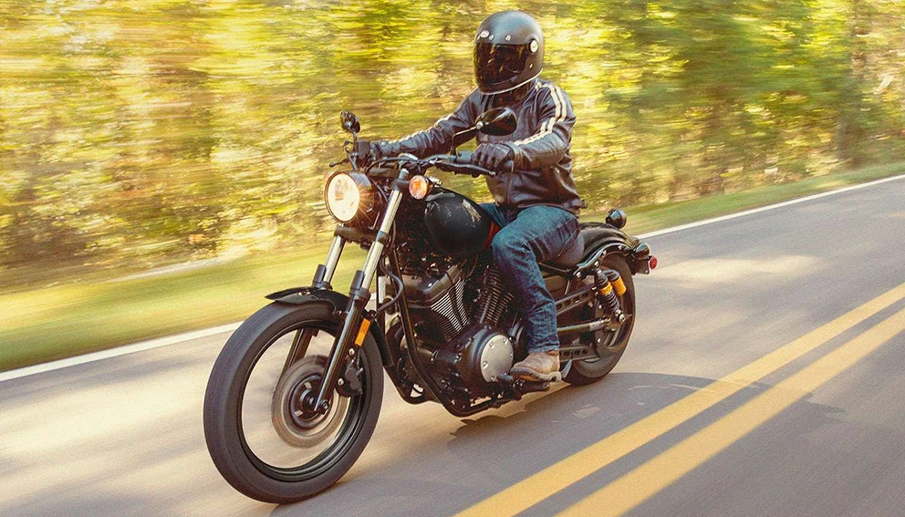 Front view of a motorcyclist on the road riding a Yamaha Bolt R-Spec