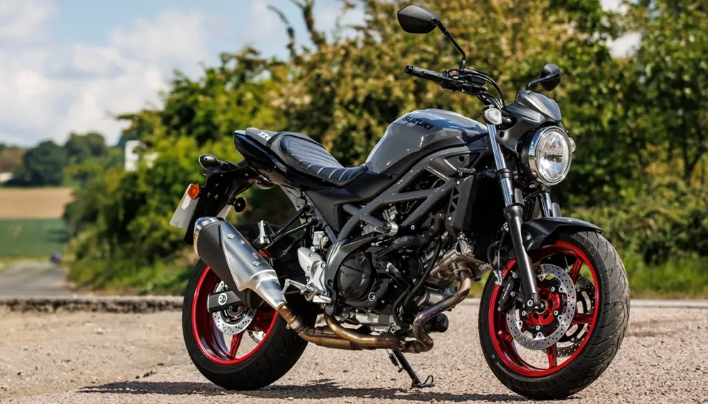 View of the Suzuki SV650 parked on the side of a sandy road