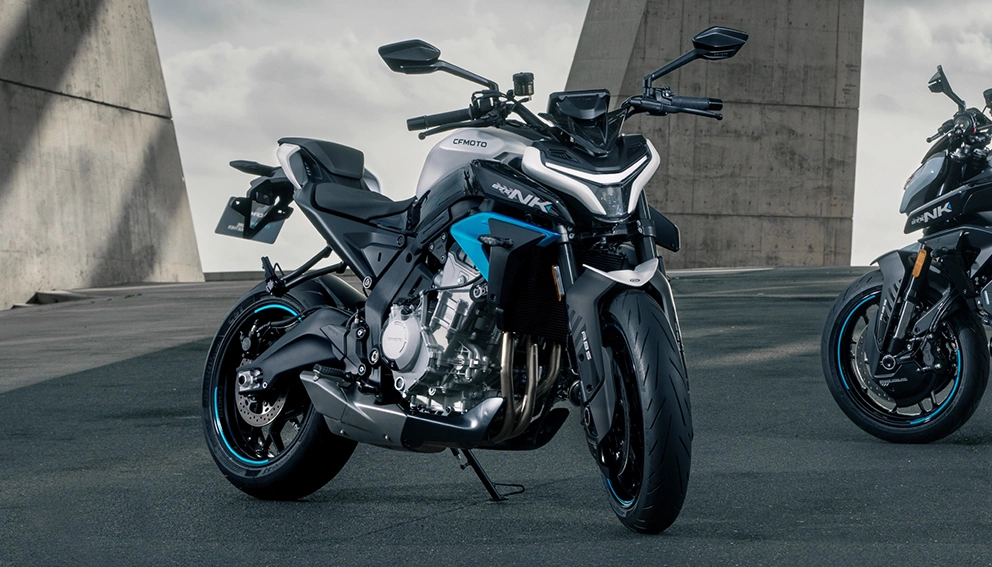 View of two CF Moto 675NKs in an urban parking lot