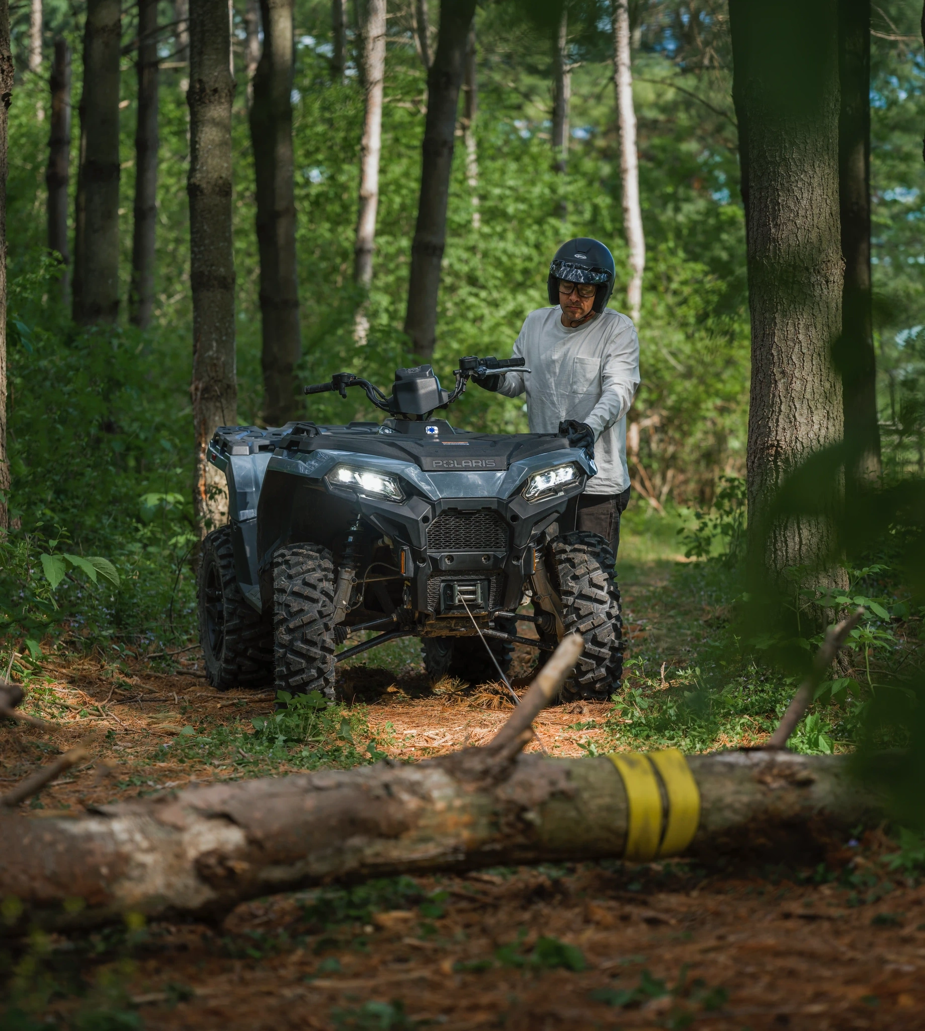 Polaris Sportsman working around property