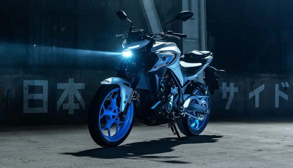 View of the Yamaha MT-03 at a standstill with its headlight on