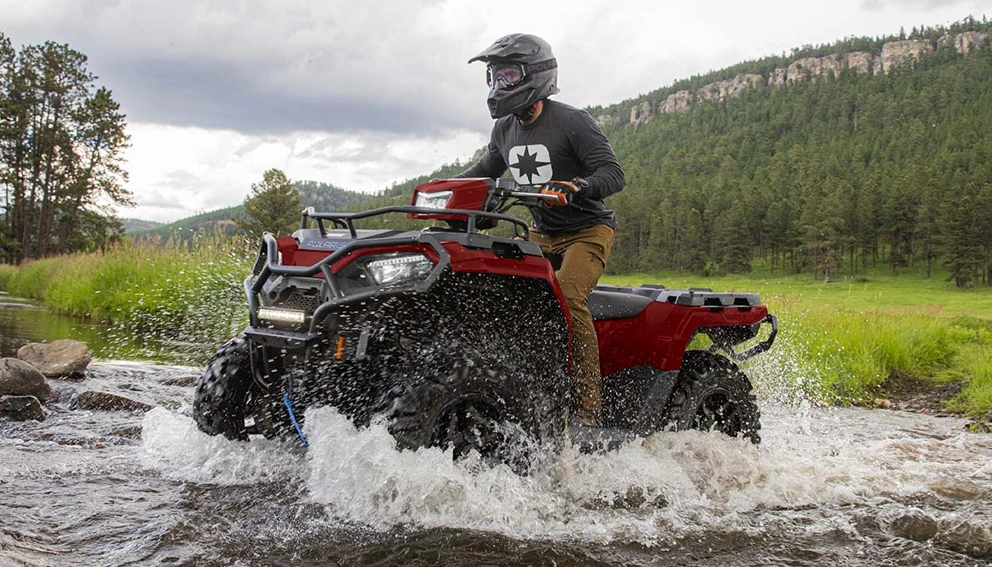 View of the Polaris Sportsman 570 Trail crossing a stream