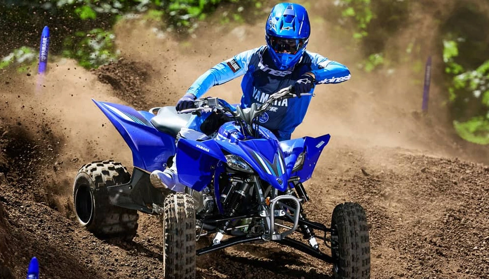 A view of the Yamaha YFZ450R at full throttle in the sand