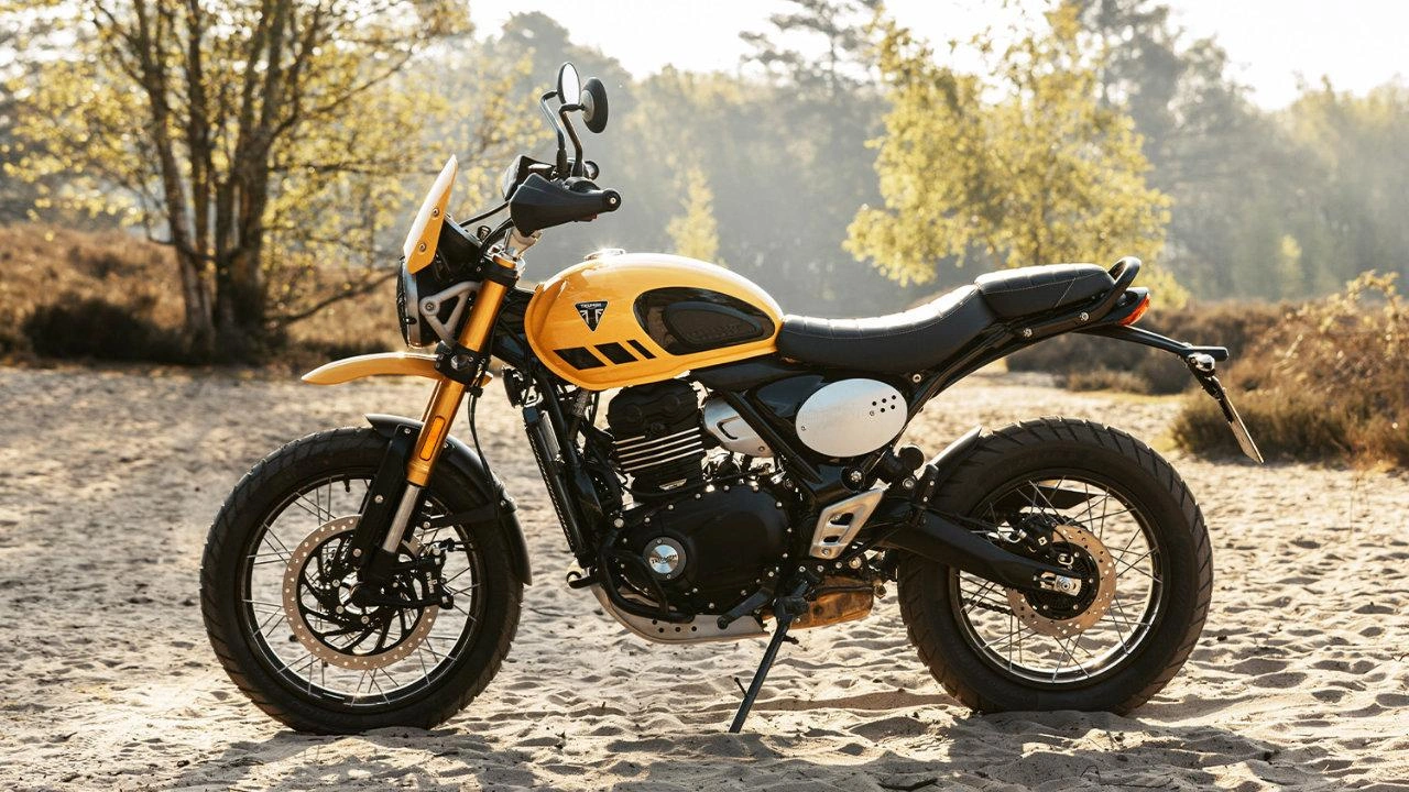 Triumph Scrambler motorcycle with high-mounted exhaust and knobby tires