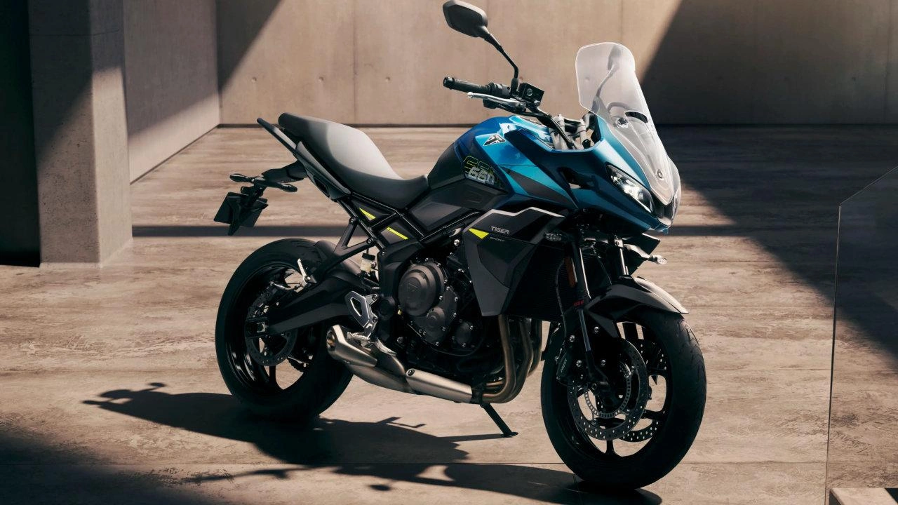 Compact Triumph Tiger Sport 660 touring motorcycle on the road