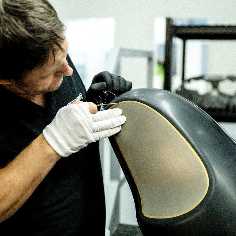 Placeholder for a Triumph craftsperson working on a custom motorcycle