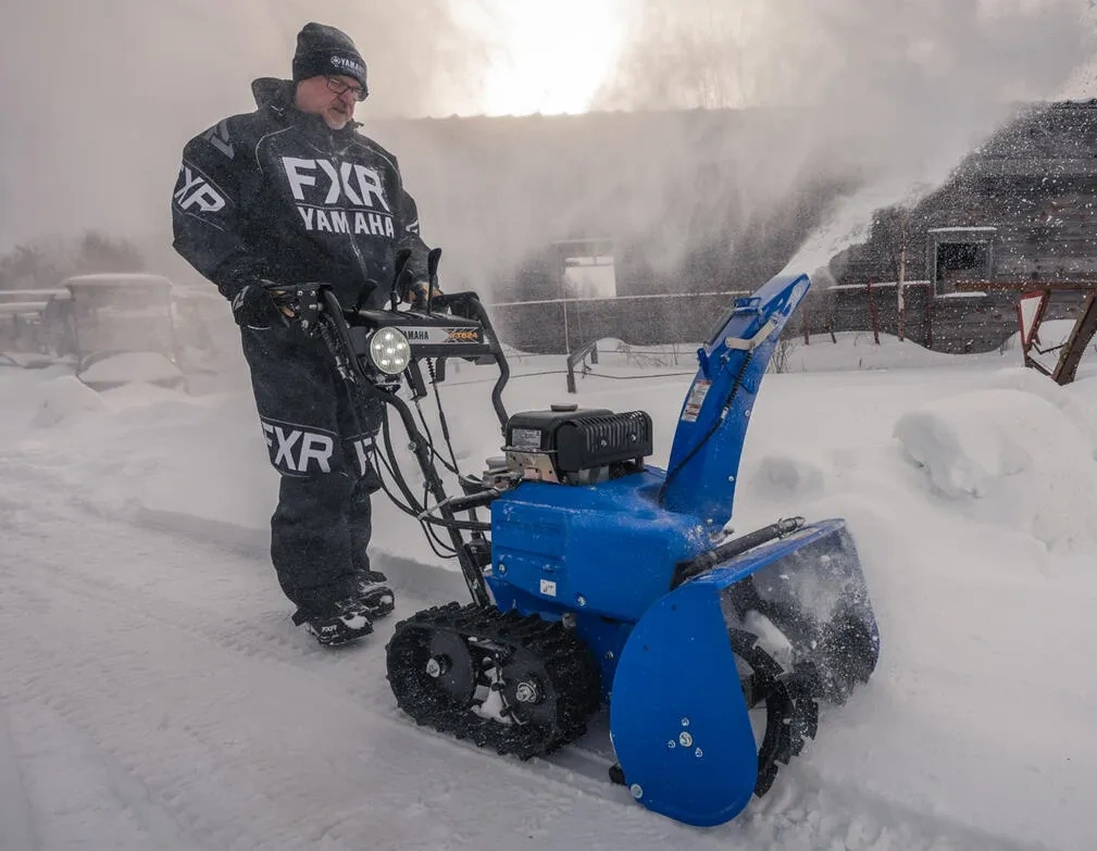 Person using a blue tracked Yamaha YT624 snowblower, shown in the context of Willbe taking over the snowblower business.