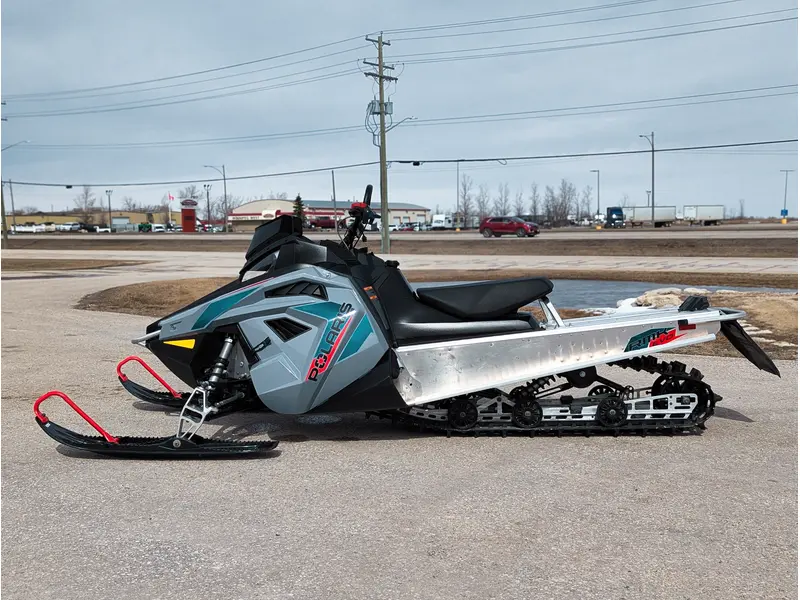 Polaris 550 RMK EVO 144 // Stealth Gray w/ GB Trail Muffler & Electric Visor Plug 2024