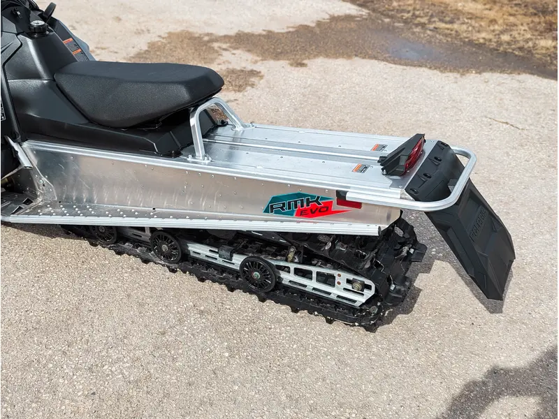 Polaris 550 RMK EVO 144 // Stealth Gray w/ GB Trail Muffler & Electric Visor Plug 2024