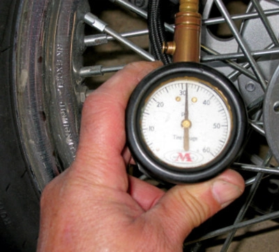 Checking motorcycle tire pressure