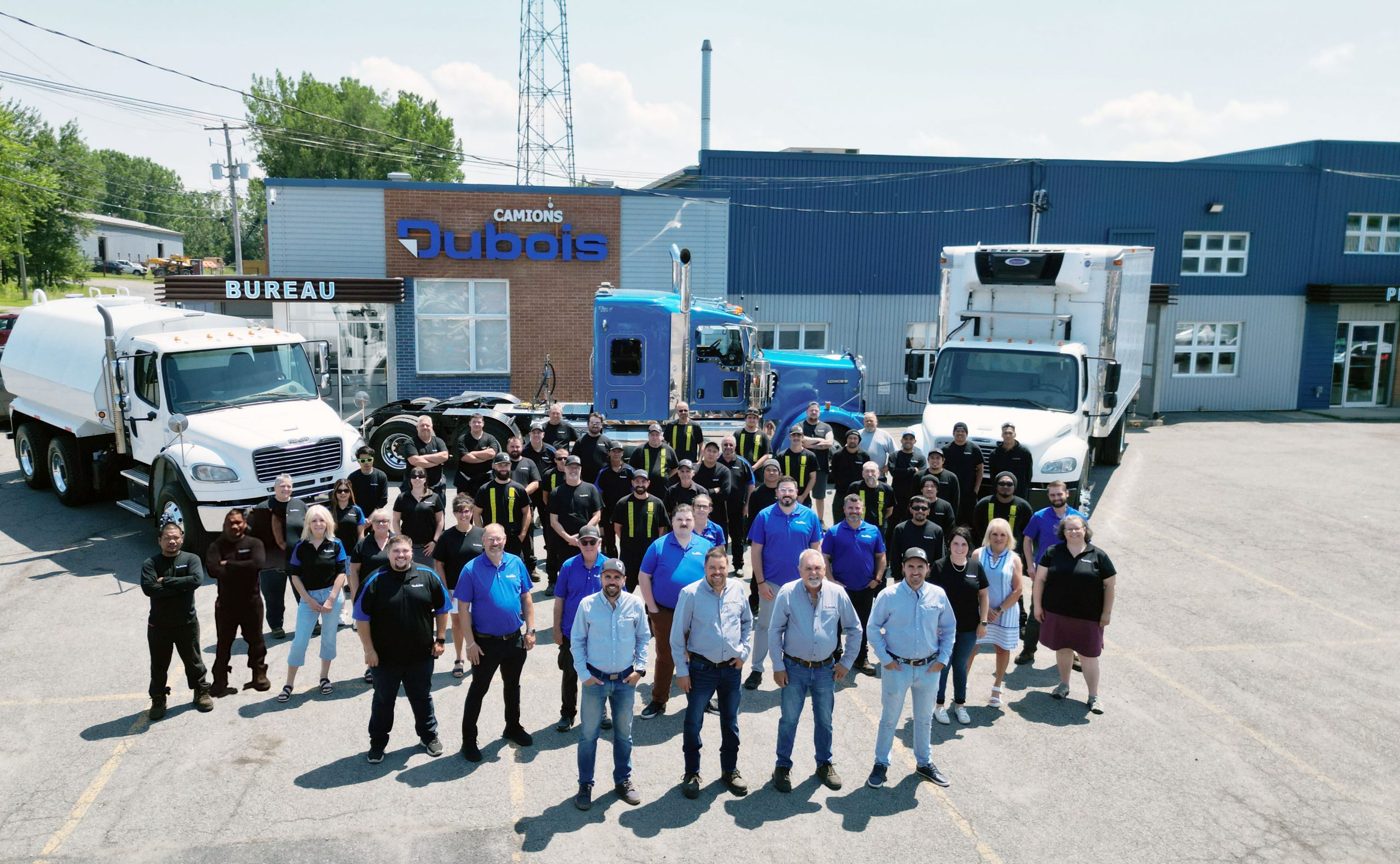 The Camions Dubois team in front of the company facilities