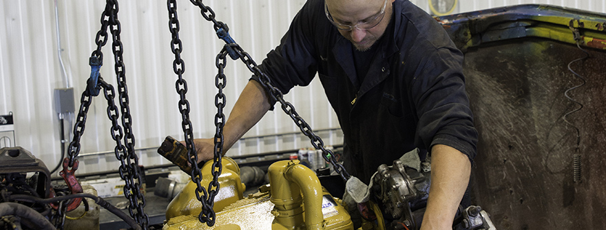 Mechanic working on a truck engine